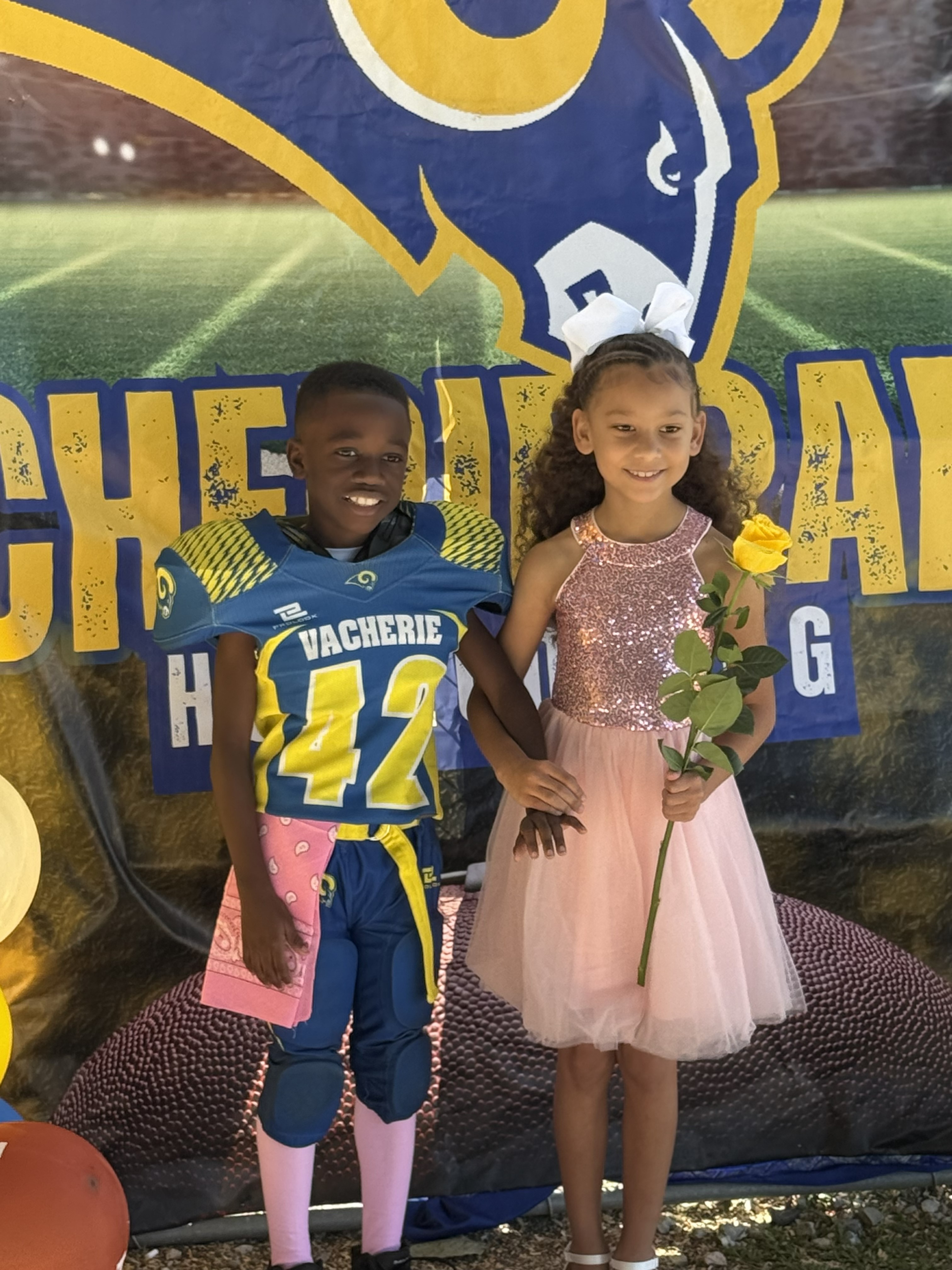 Tariq and Homecoming Partner Holding Hands